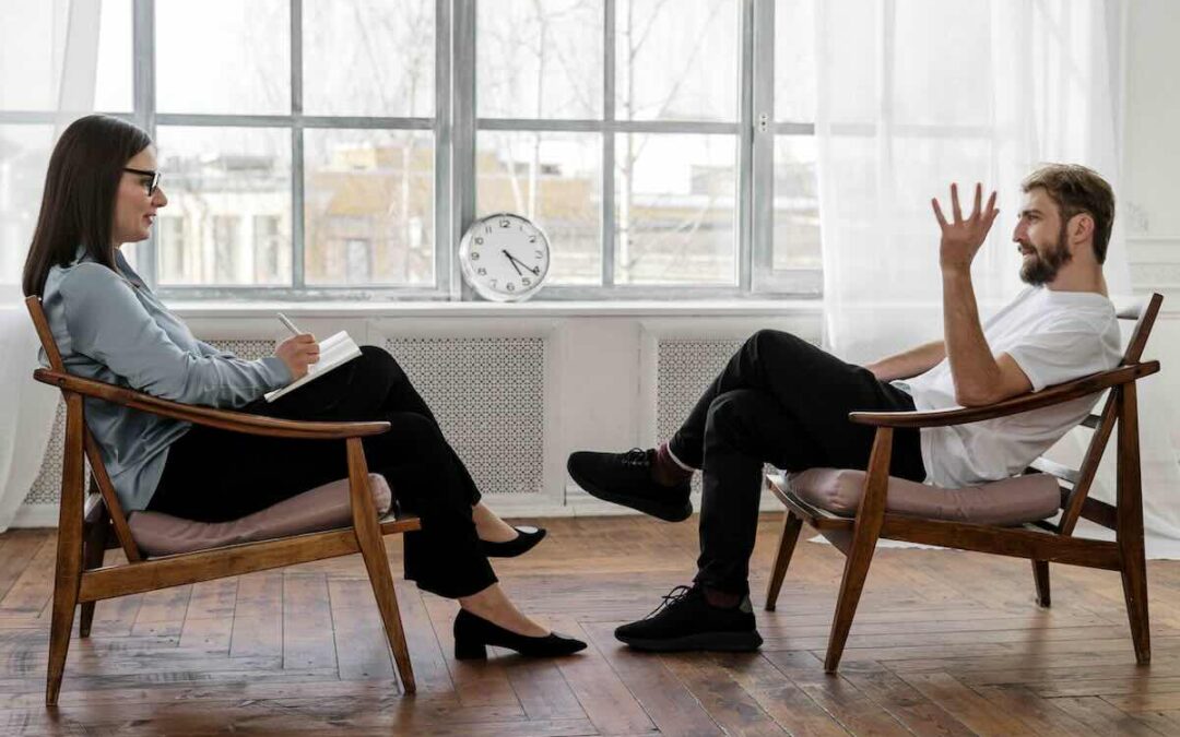 A Psychologist talking to a patient about seeing a social worker